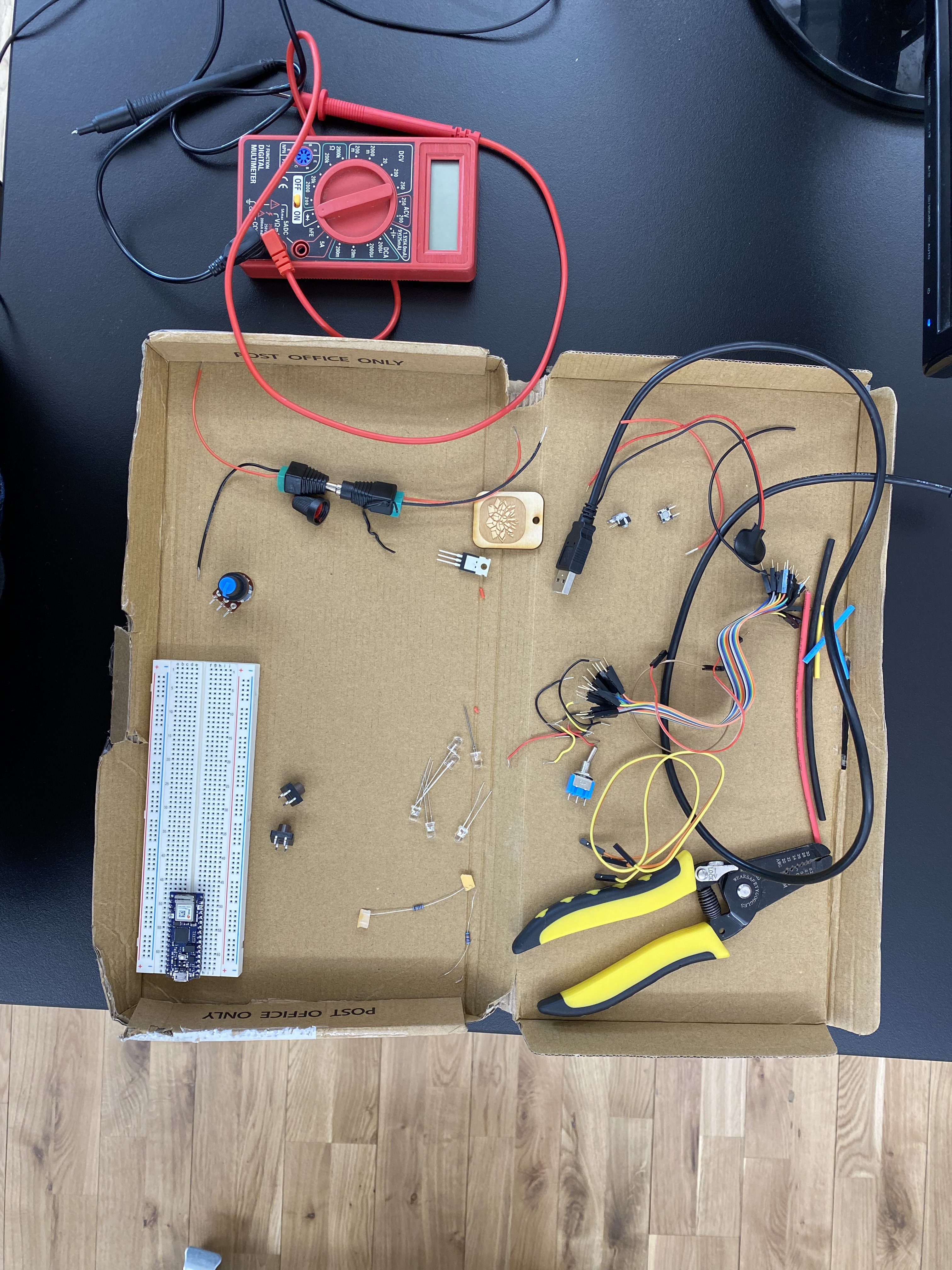 A picture of misc components in a cardboard tray.